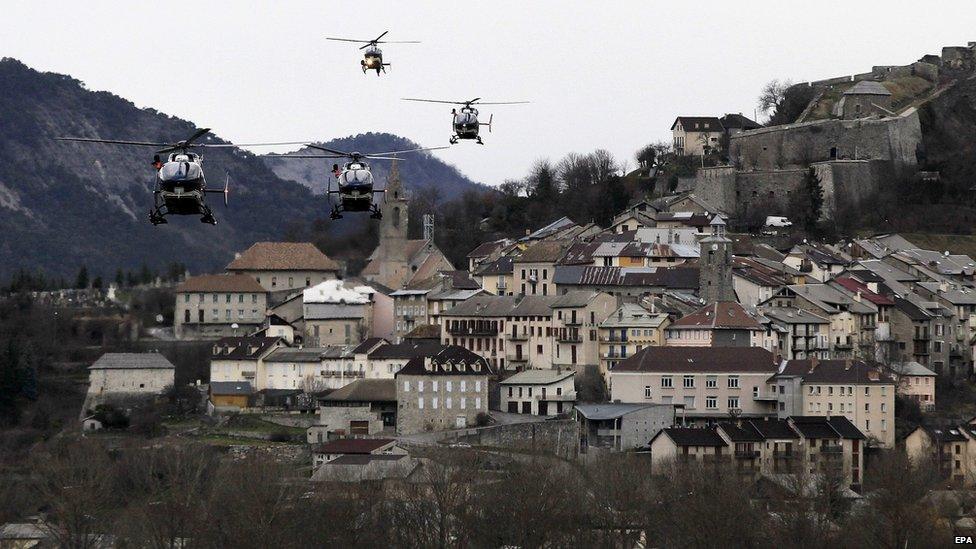 Helicopters of the French gendarmerie and emergency services fly over Seyne-les-Alpes