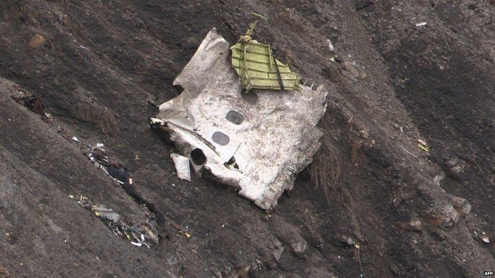 A screen grab taken from an AFP TV video on 24 March 2015 shows debris at the crash site of the Germanwings Airbus A320