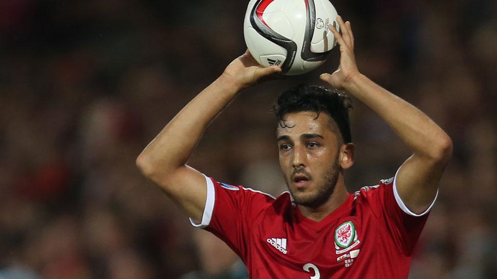 Neil Taylor takes a throw-in for Wales