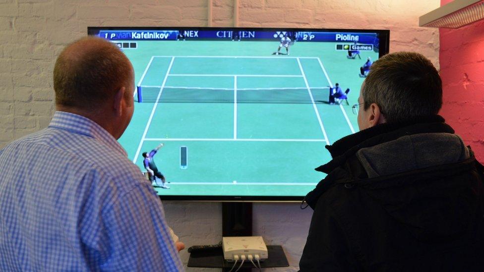 Ian Livingstone plays tennis