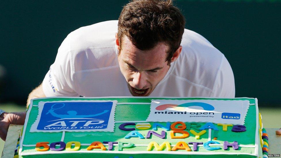 Andy Murray holding cake