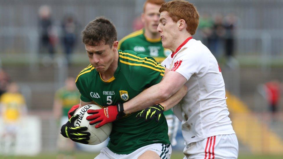 Kerry's Jonathan Lyne attempts to hold off the challenge of Peter Harte of Tyrone