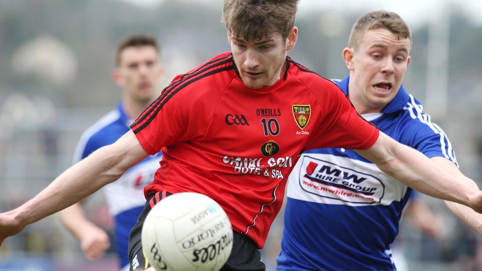 Conor Laverty in action against Damian Strong of Laois during the Division Two match which saw Down win 3-12 to 1-15 to clinch promotion