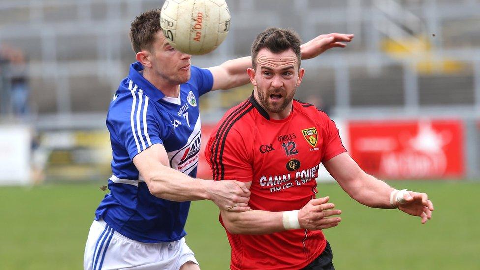 Down's Mark Poland in action against Colm Begley of Laois at Pairc Esler