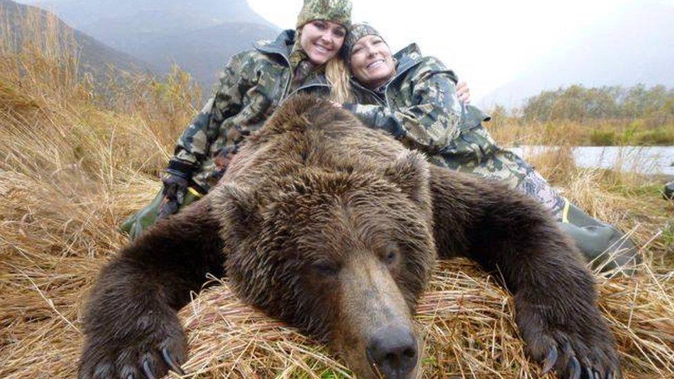 Rebecca Francis poses with a bear