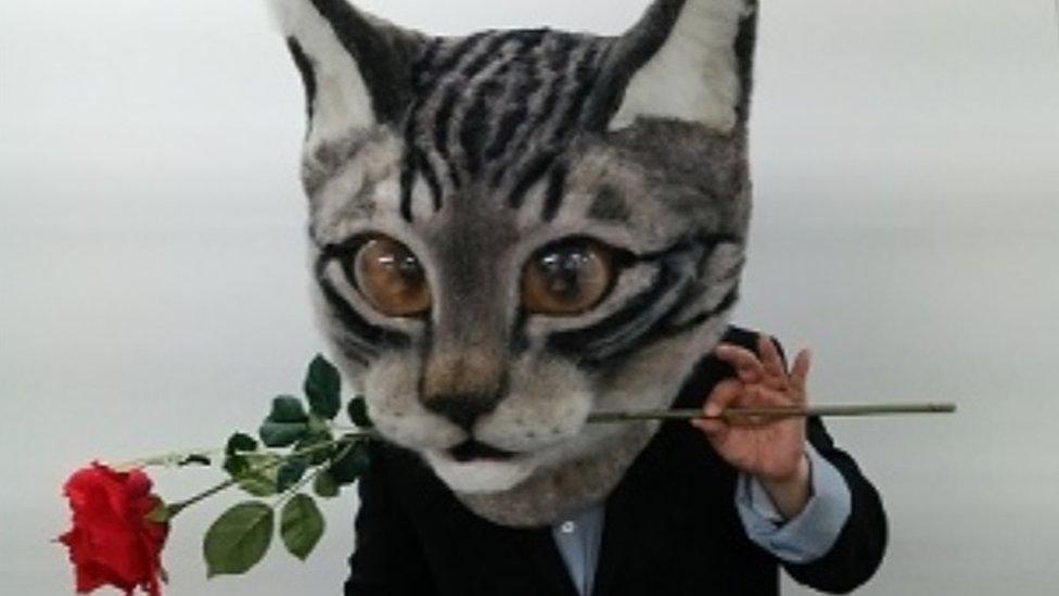 Wearing a cat head could turn you into a romantic