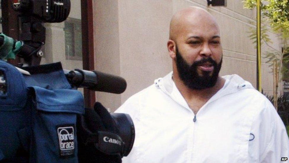 Suge Knight with a camera pointing at him