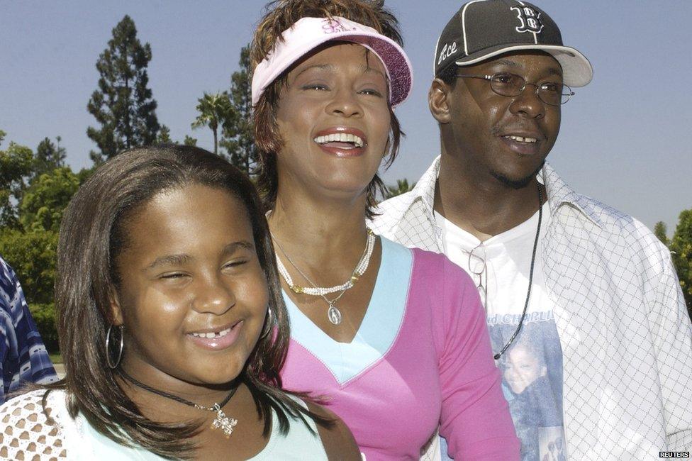Bobbi Kristina Brown with her parents, Whitney Houston and Bobby Brown.