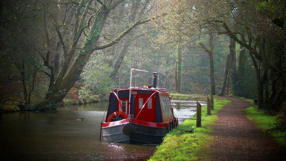 Red canal boat on the Monmouthshire and Brecon Canal