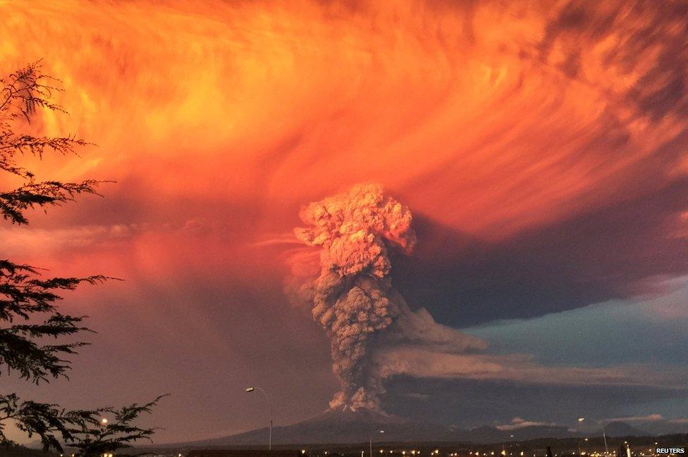 Smoke and ash rise from the Calbuco volcano as seen from the city of Puerto Montt, 22 April 2015.