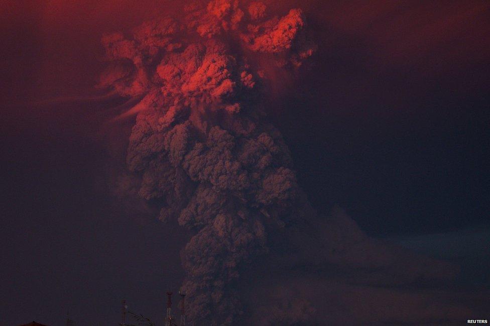 Smoke and ash rise from the Calbuco volcano as seen from the city of Puerto Montt, 22 April 2015.