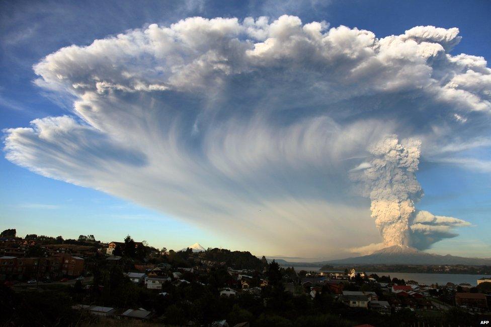 View from Puerto Montt, southern Chile, of a high column of ash and lava spewing from the Calbuco volcano, 22 April 2015.