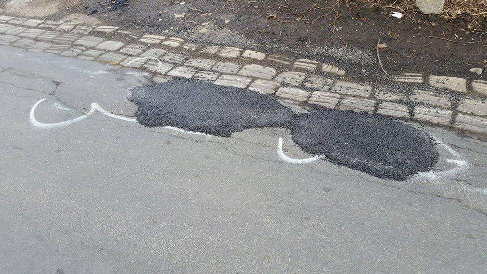 A filled-in pothole