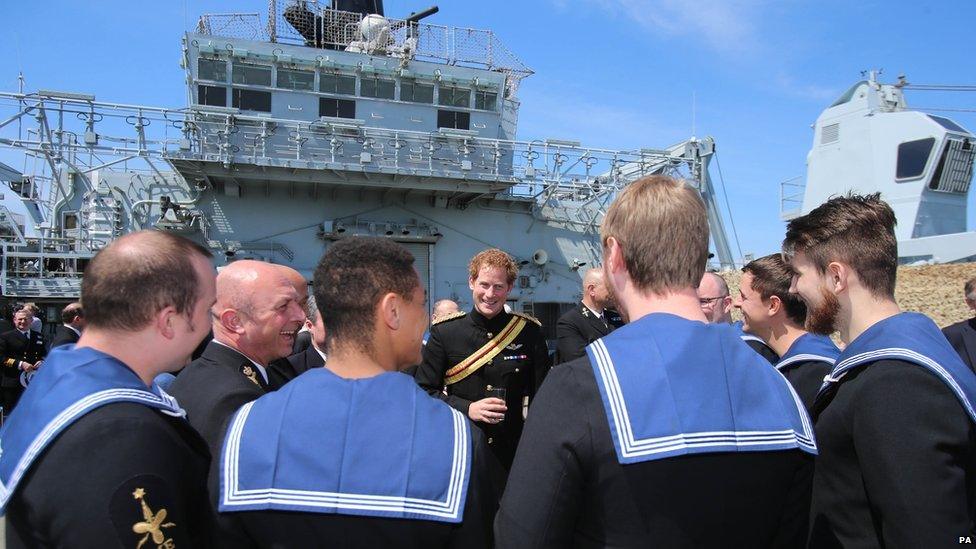 Prince Harry meets crew members as he attends a reception on HMS Bulwark with relatives of veterans of the Gallipoli Campaign