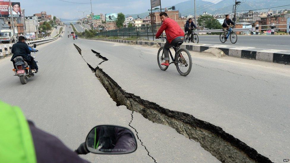 Damaged roads are seen after an earthquake on the outskirts of Kathmandu (26 April 2015)