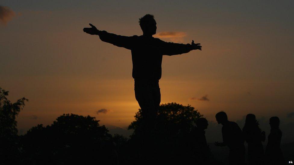 Man in silhouette against the setting sun