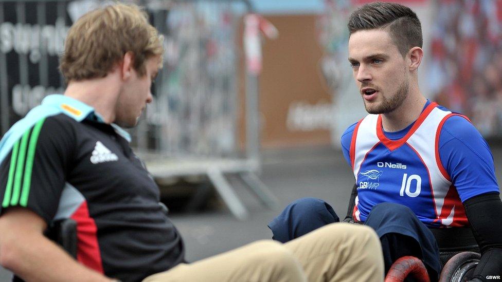 Chris Ryan chatting to another wheelchair rugby player