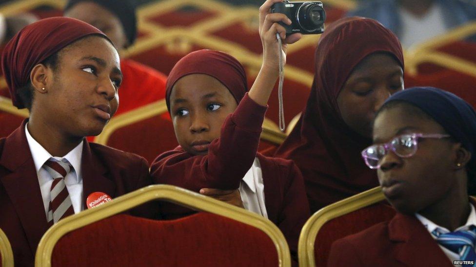 A girl using a camera in Abuja, Nigeria - Thursday 30 April 2015