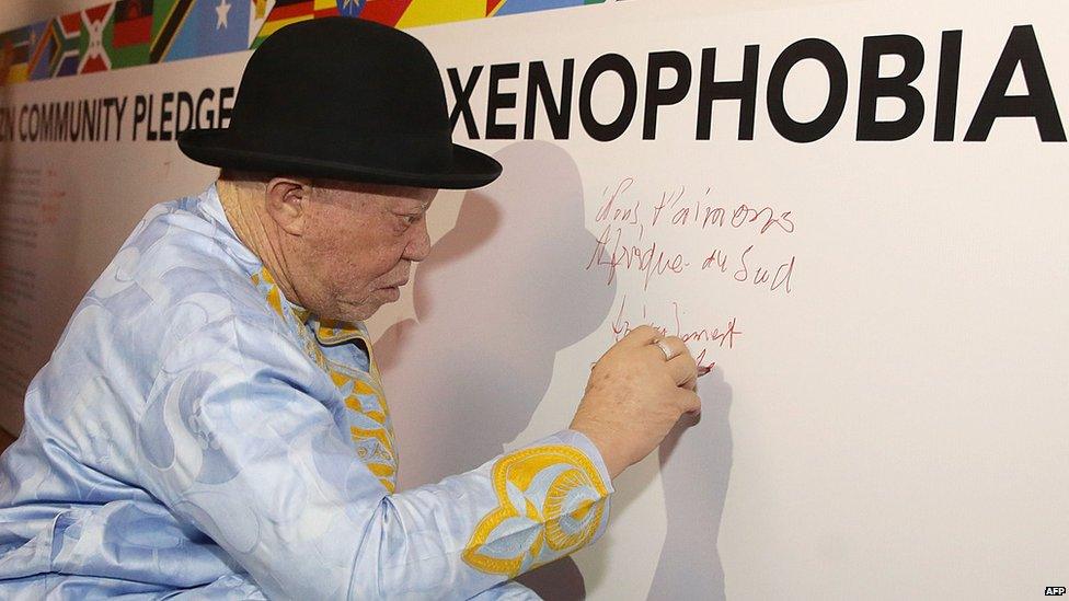 Malian singer Salif Keita writing on a banner in Durban, South Africa - Sunday 26 April 2015