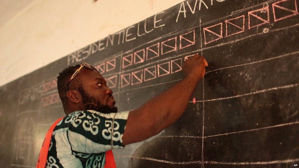 An electoral official marking a blackboard in Lome, Togo - Saturday 25 April 2015