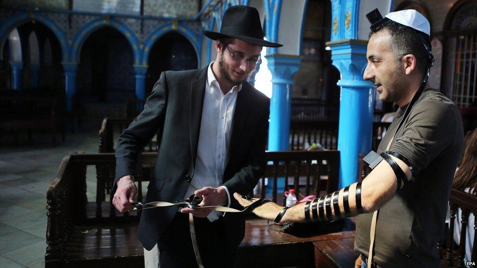A rabbi blesses a Jewish pilgrim in the ancient Ghriba Synagogue on the island of Djerba south of Tunis, Tunisia, 7 May 2015