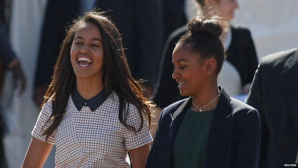 Michelle Obama has often described herself as 'Mom-in-chief' to her daughters Malia (L) and Sasha