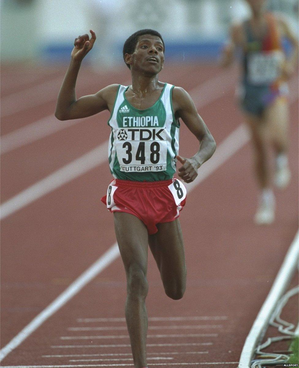 Haile Gebrselassie of Ethiopia crosses the finishing line to win the gold medal in the 10000 Metres event at the 1993 World Championships in Stuttgart, Germany.