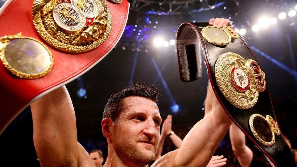 Carl Froch with two world title belts