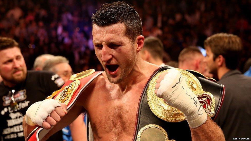 Froch with world title belts