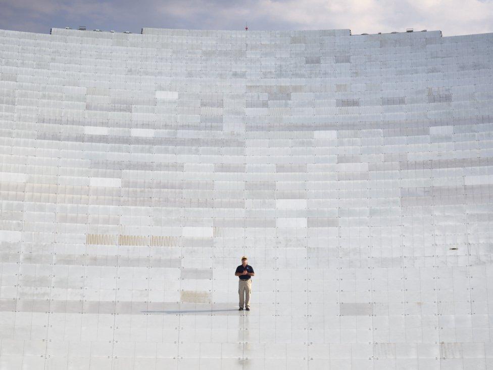 Mike Holstine standing on the Green Bank Telescope