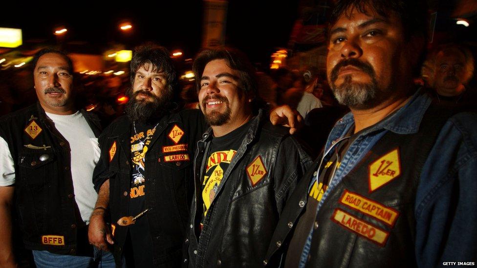 Four Bandido member wearing their biker jackets