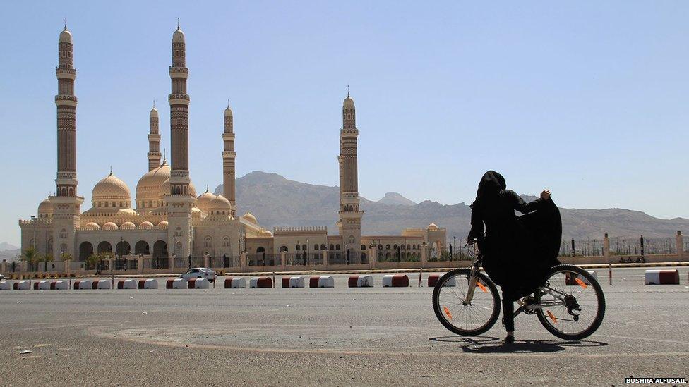 Yemeni girl riding a bike in the capital Sanaa