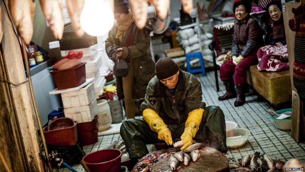 Preparing fish at one of Busan's Deokpo fish markets