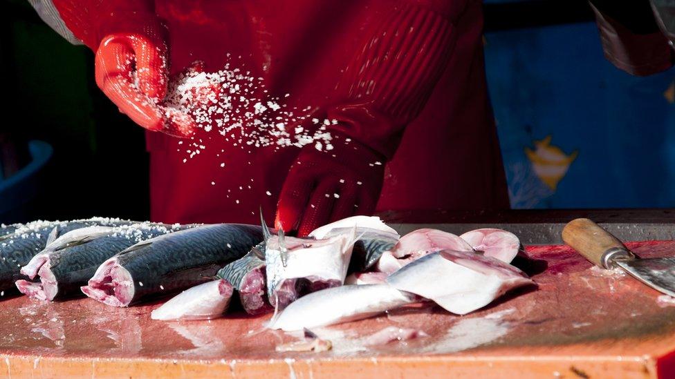 Salting fish at Jagalchi market.