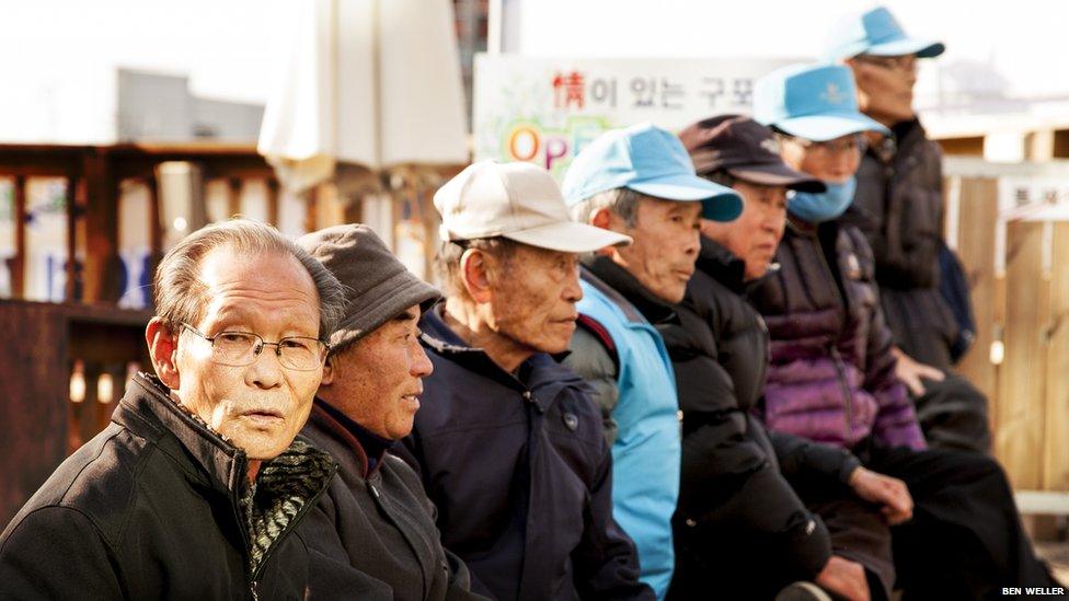 A group of pensioners gather at Gupo market in Busan.