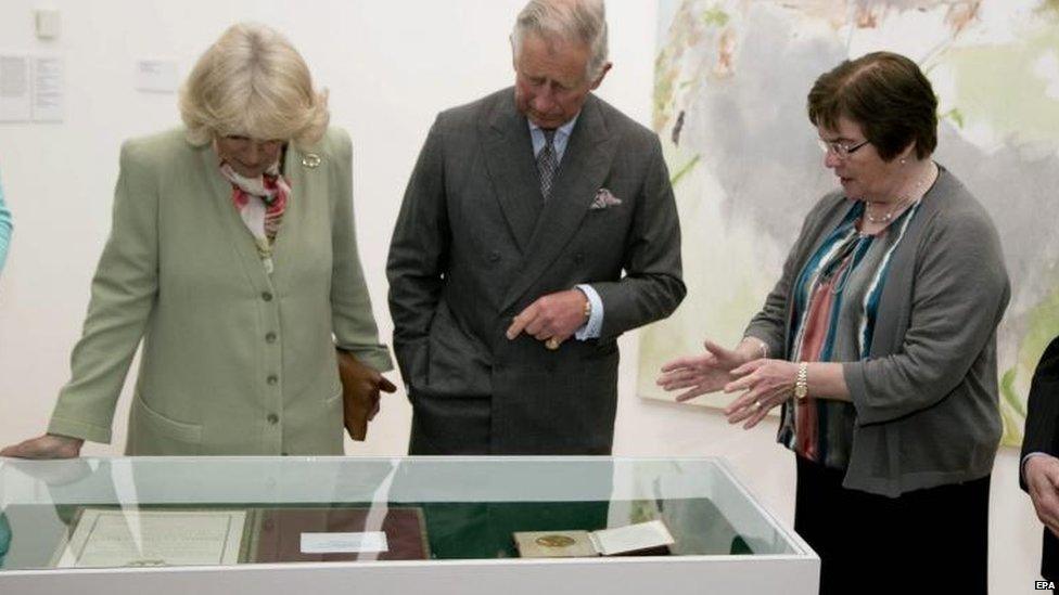 Caitriona Yeats, granddaughter of Irish poet WB Yeats, shows Prince Charles and his wife Camilla medals and scrolls belonging to her grandfather during the royal couple's visit to The Model cultural centre in Sligo