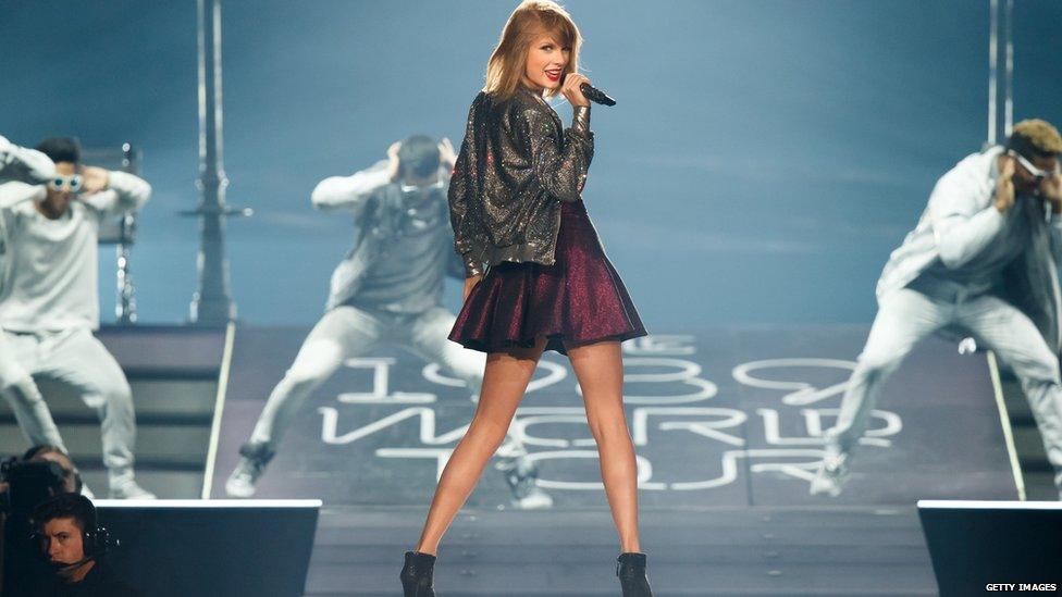 Taylor Swift performs on stage