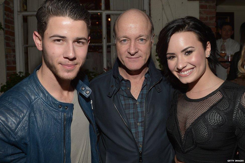 Nick Jonas, Phil McIntyre and Demi Lovato