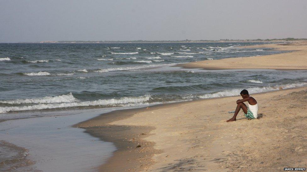 One man sitting on Berbera beacch