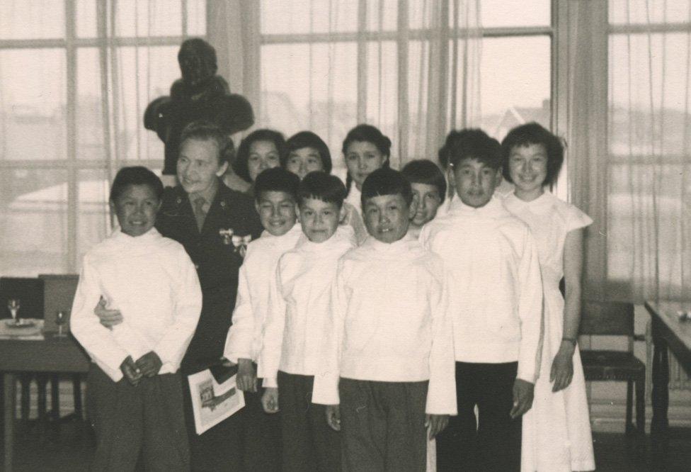 Helene Thiesen (back, third child from left) with other children in the home in Greenland