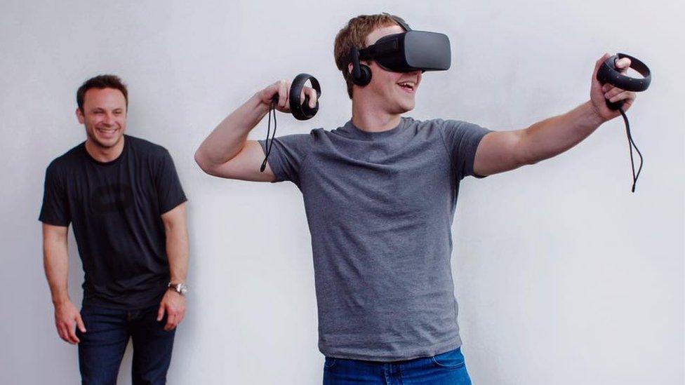 Mark Zuckerberg grins as he tries out Oculus Rift