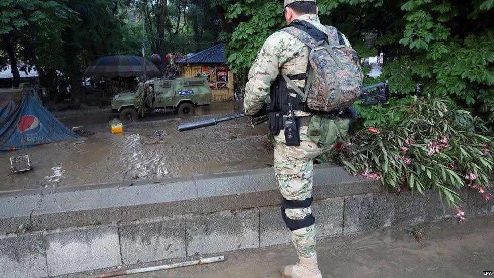 An armed policemen on guard after the zoo animals escaped (14 June 2015)