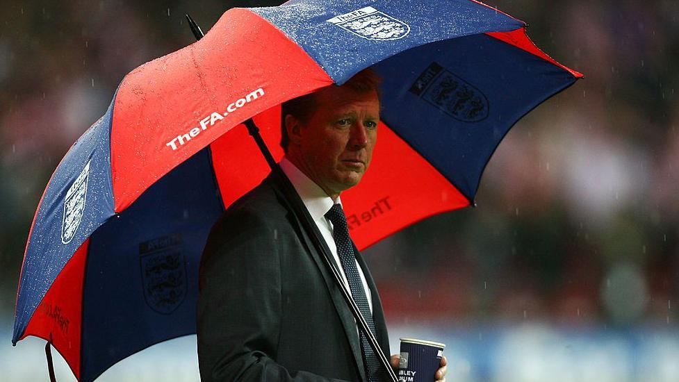 Steve McClaren sheltering under an umbrella during the Euro 2008 qualifier defeat at home to Croatia