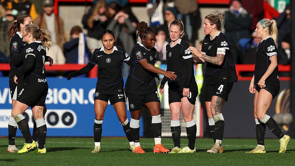 Chelsea celebrate scoring against Brighton