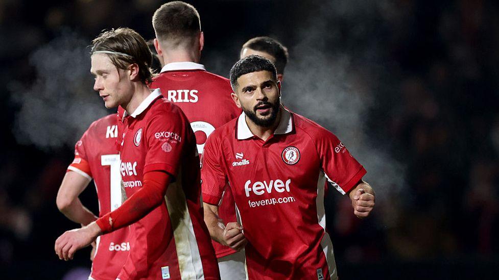 Sam Morsy celebrates with Bristol City team-mates during their FA Cup win over Watford