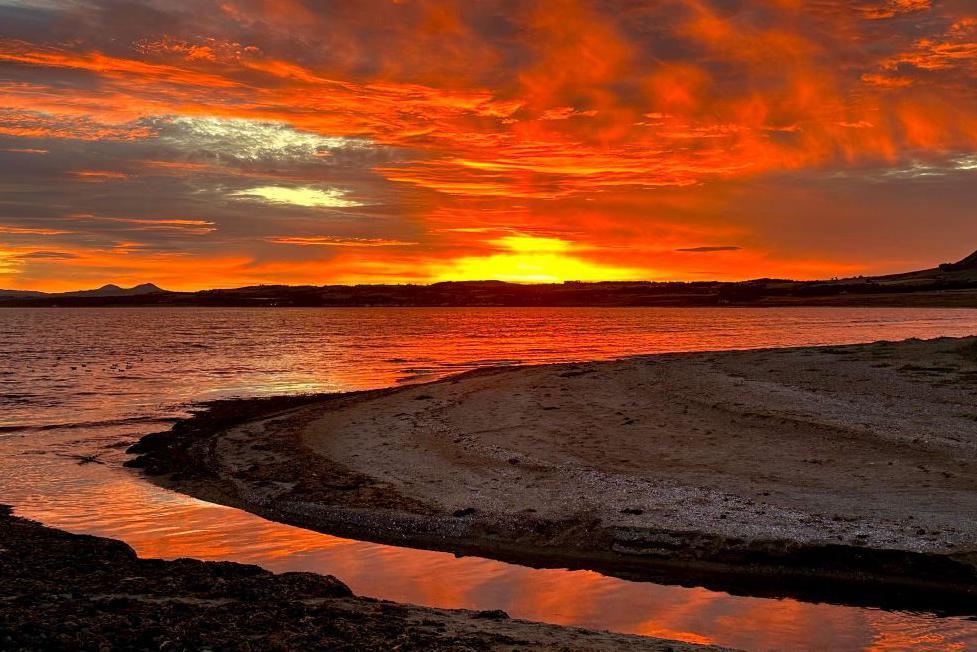 A fiery night sky pictured at Earlsferry, Fife