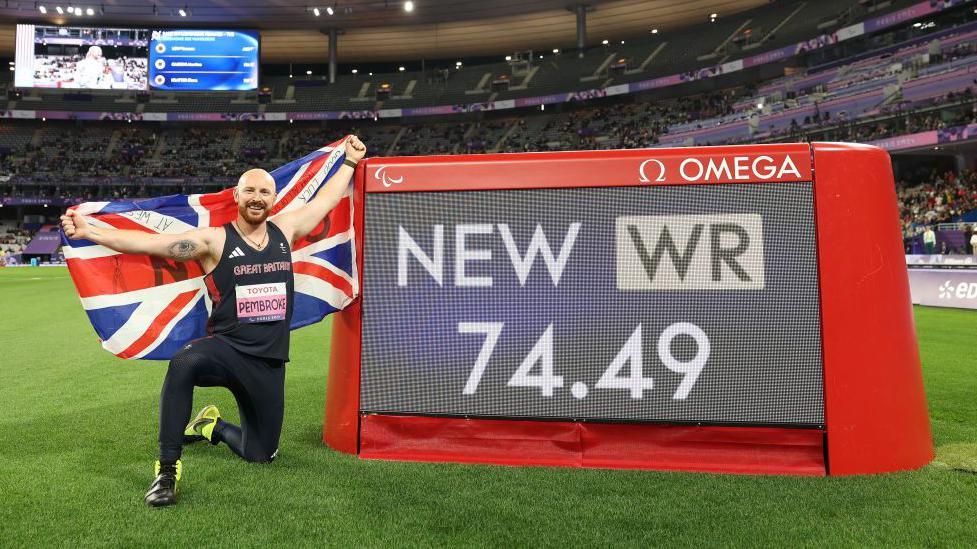 Dan Pembroke poses next to his world record