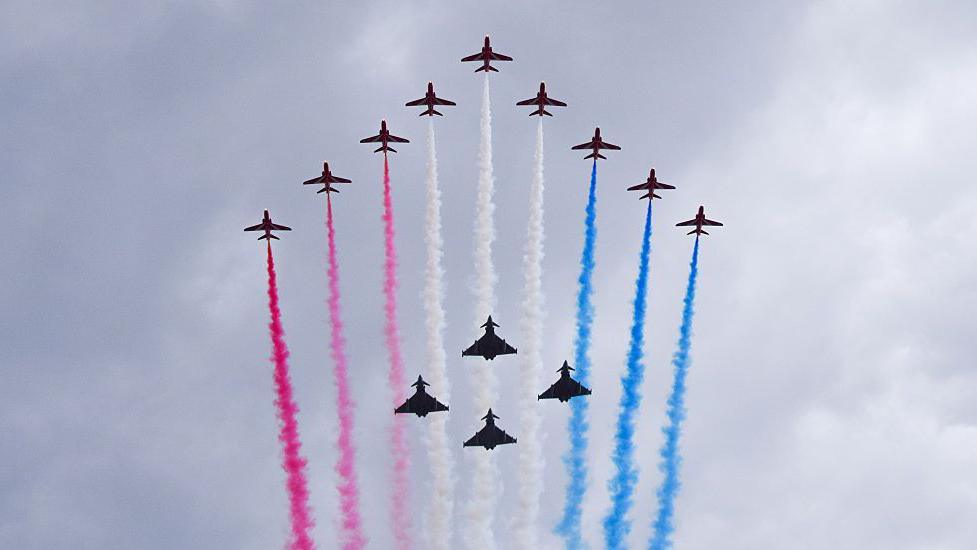 Red Arrows perform a flypast over The Mall