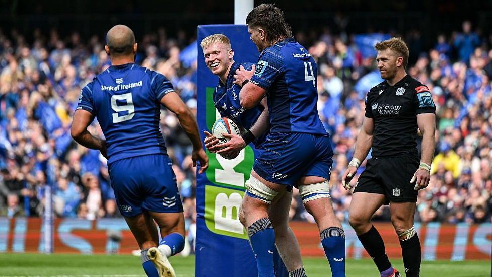 Leinster's Jamie Osborne (centre) celebrates one of his two tries