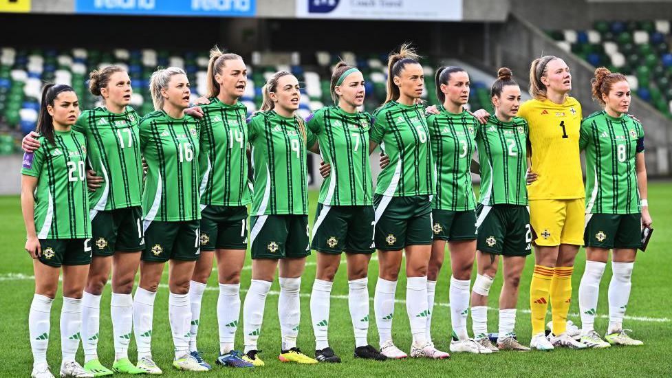 Players of Northern Ireland participate in the national anthem prior to the UEFA EURO 2025 Women's Qualifiers match between Northern Ireland and Malta at Windsor Park.